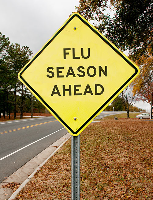 Fake road sign that says Flu Season Ahead